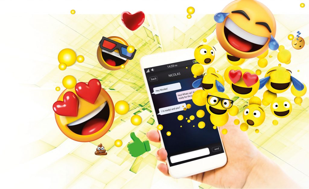 Emojier kommer ut av en telefon