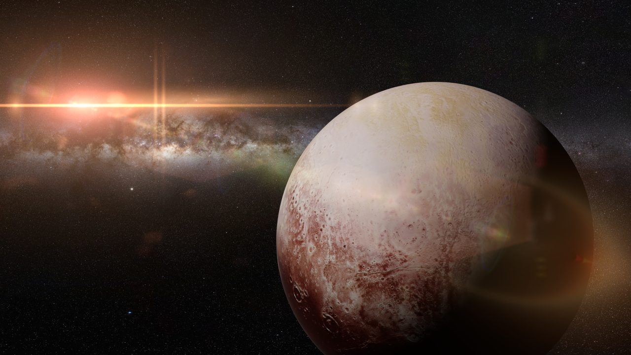 Dvergplaneten Pluto foran en lysende galakse