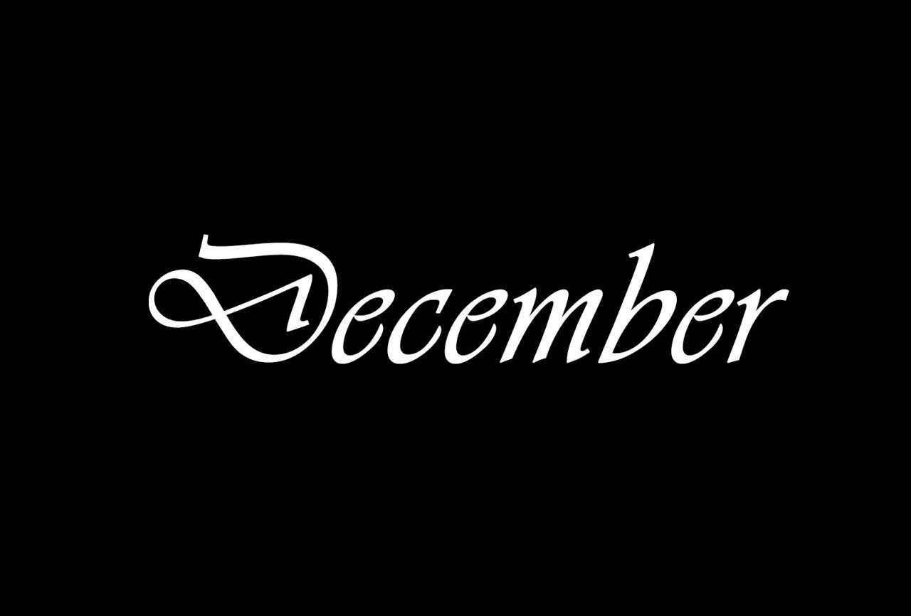 The month December written in white on a black background