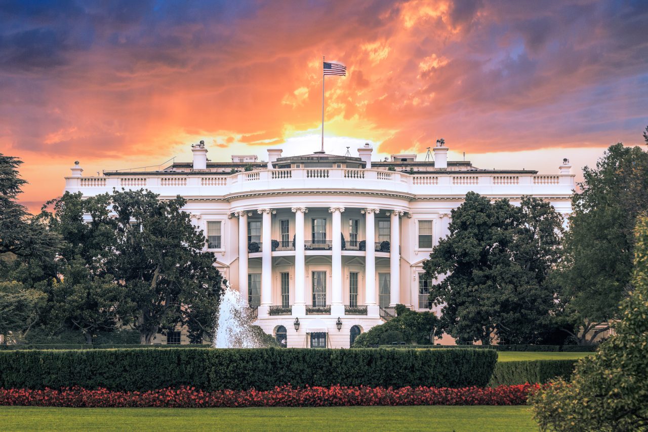 White House, under dramatic sky, sunset golden light, Washington DC